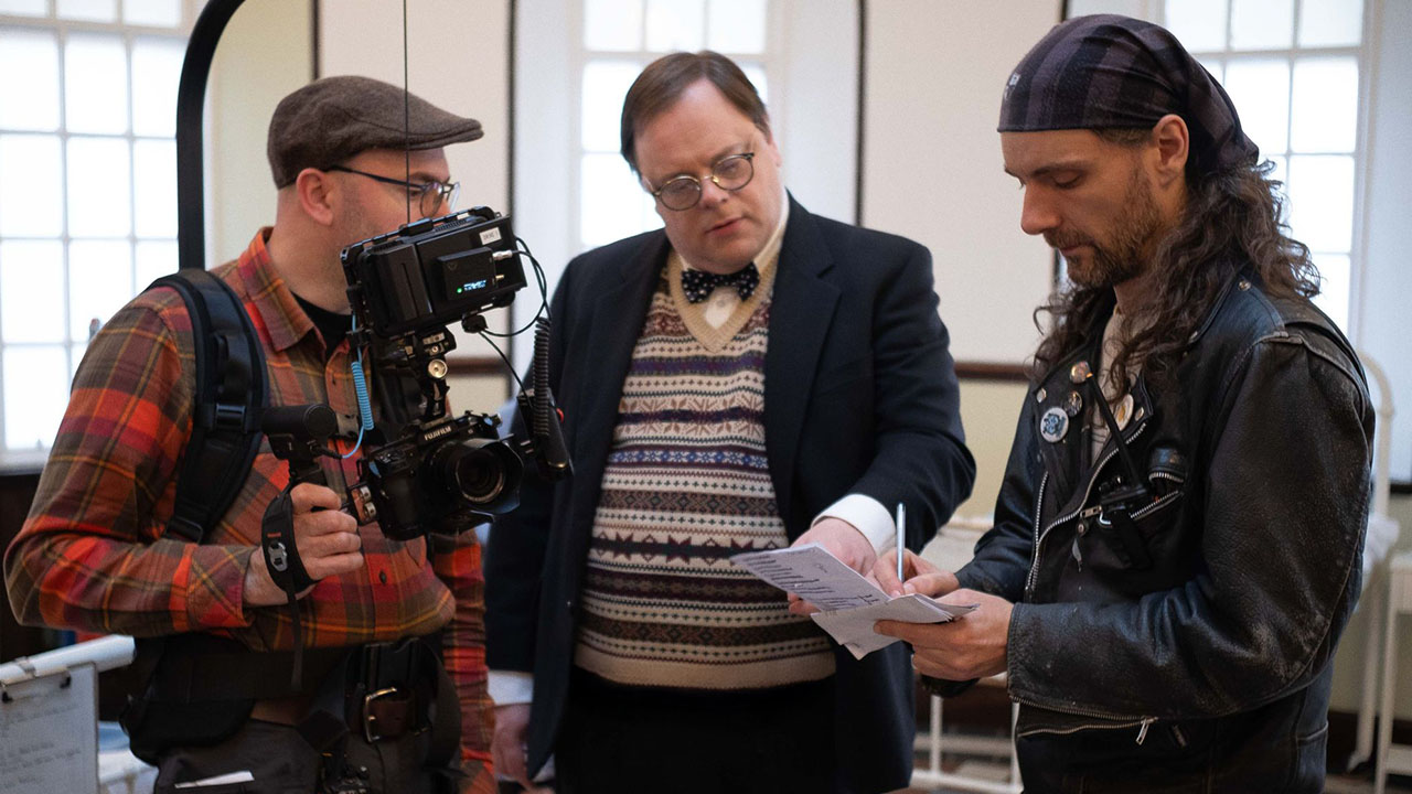 Lawrie Brewster reviewing a scene with the camera crew.