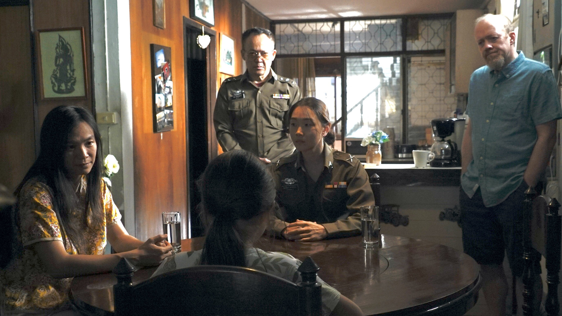 Olivia, her parents and police officers in a scene from Crushed.