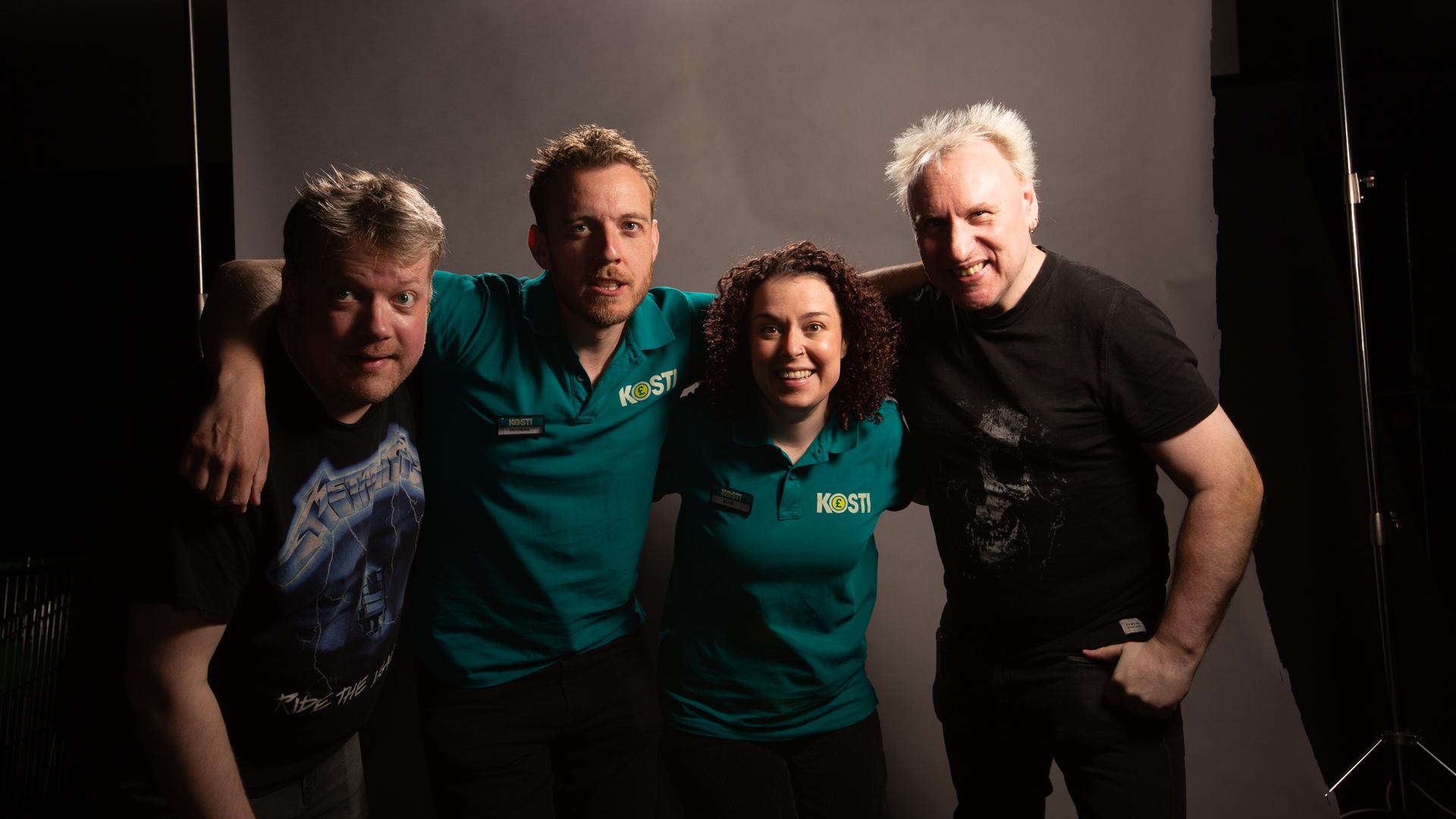 Four members of the Employee of the Dead team posing together.
