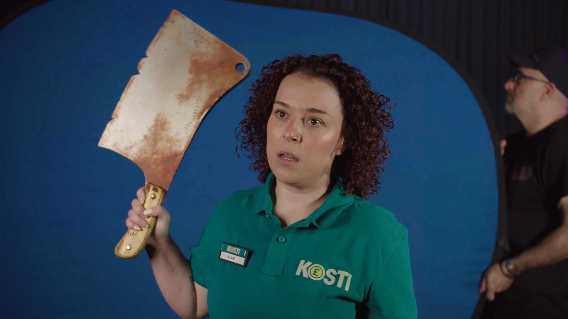 Dani Harmer holding a prop cleaver.