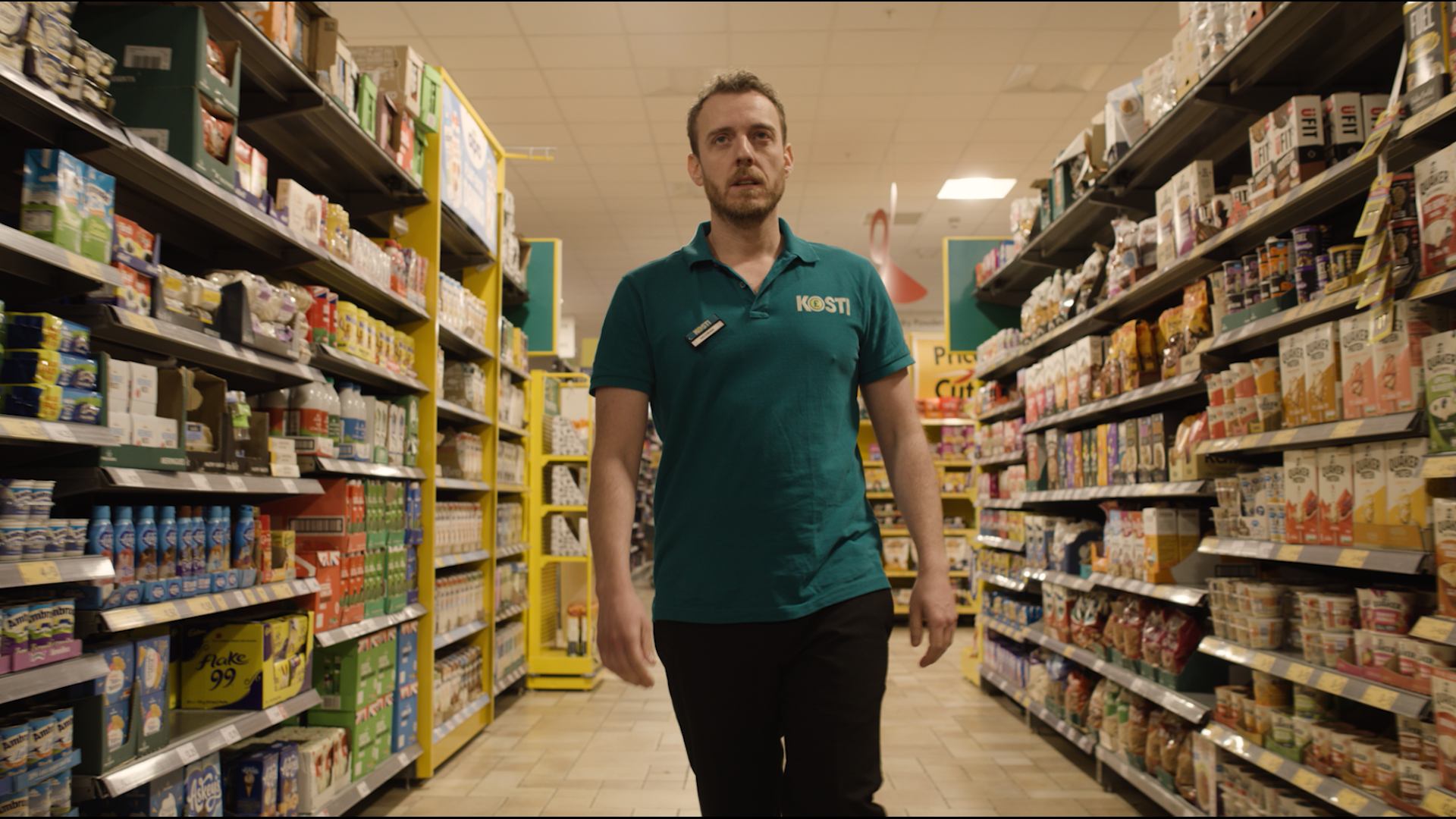 Joe Acres in a supermarket aisle.